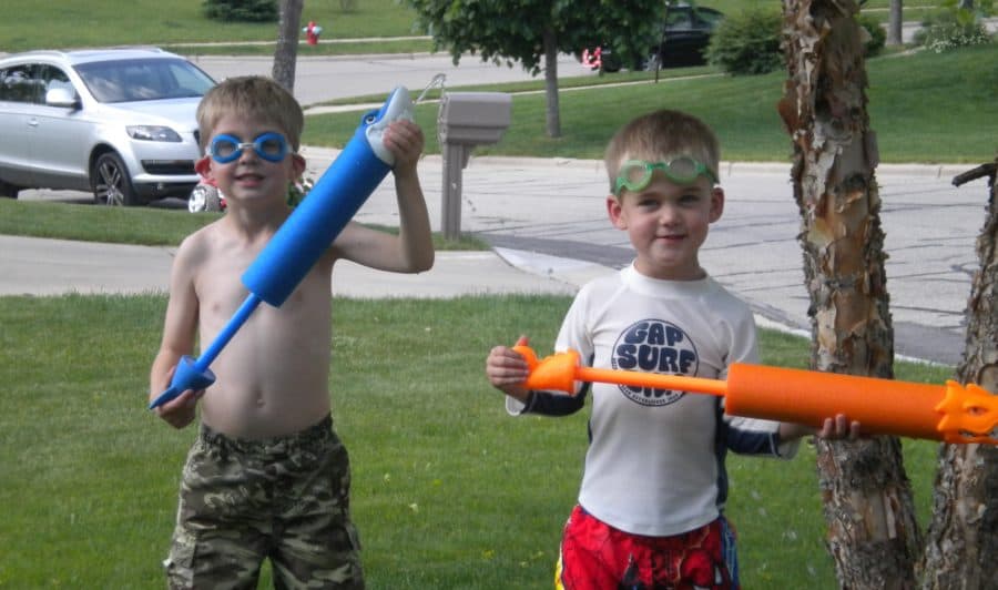 Boys with water blasters